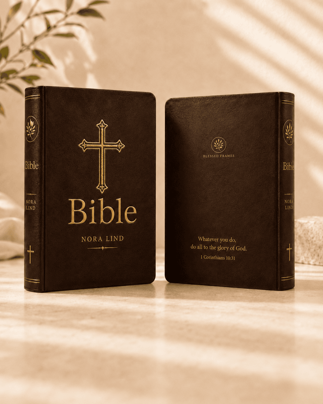 The Blessed Frames Personal Bible, front and back covers standing together. Brown leather hardcover with gold-foil cross and engraved name on the front; Blessed Frames mark and engraved verse on the back.